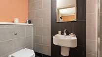 The modern en suite shower-room for bedroom one.