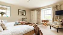 Prepare for a restful night's sleep in beautiful bedroom 5 with its super-king bed.