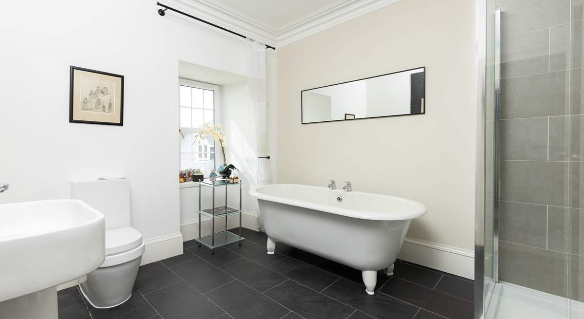 The en suite to bedroom 2 has an indulgent freestanding bath.