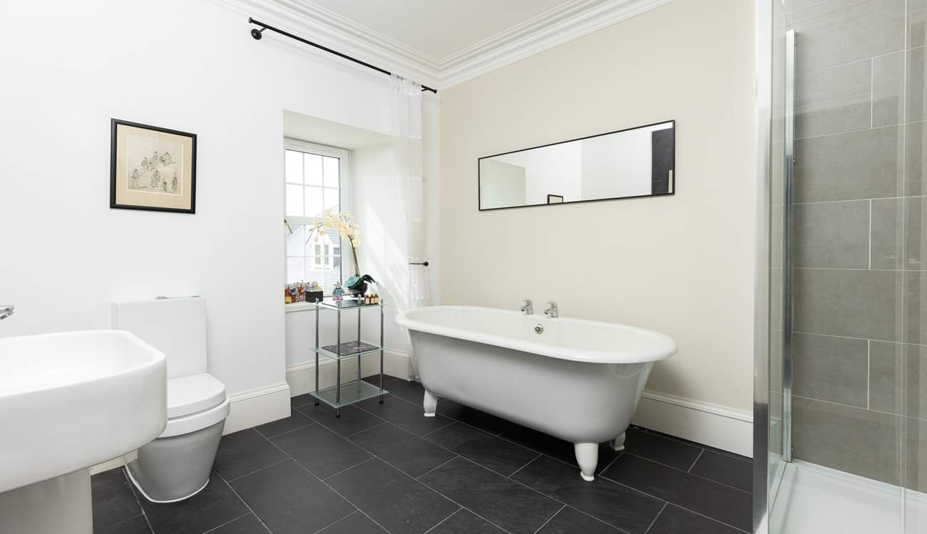 The en suite to bedroom 2 has an indulgent freestanding bath.