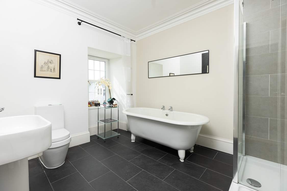 The en suite to bedroom 2 has an indulgent freestanding bath.