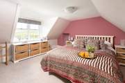 Bedroom 8 completes the family suite with views over the Kyle.