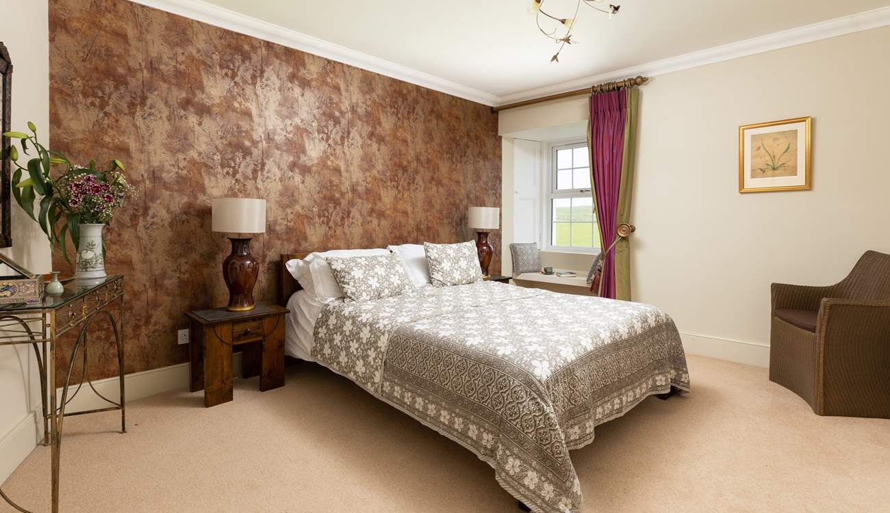 Bedroom 6 is another inviting bedroom with a king-size bed.