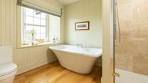 Soak in a bath of bubbles and enjoy a moment of relaxation in the en suite to bedroom 5.