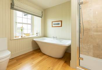 Soak in a bath of bubbles and enjoy a moment of relaxation in the en suite to bedroom 5.