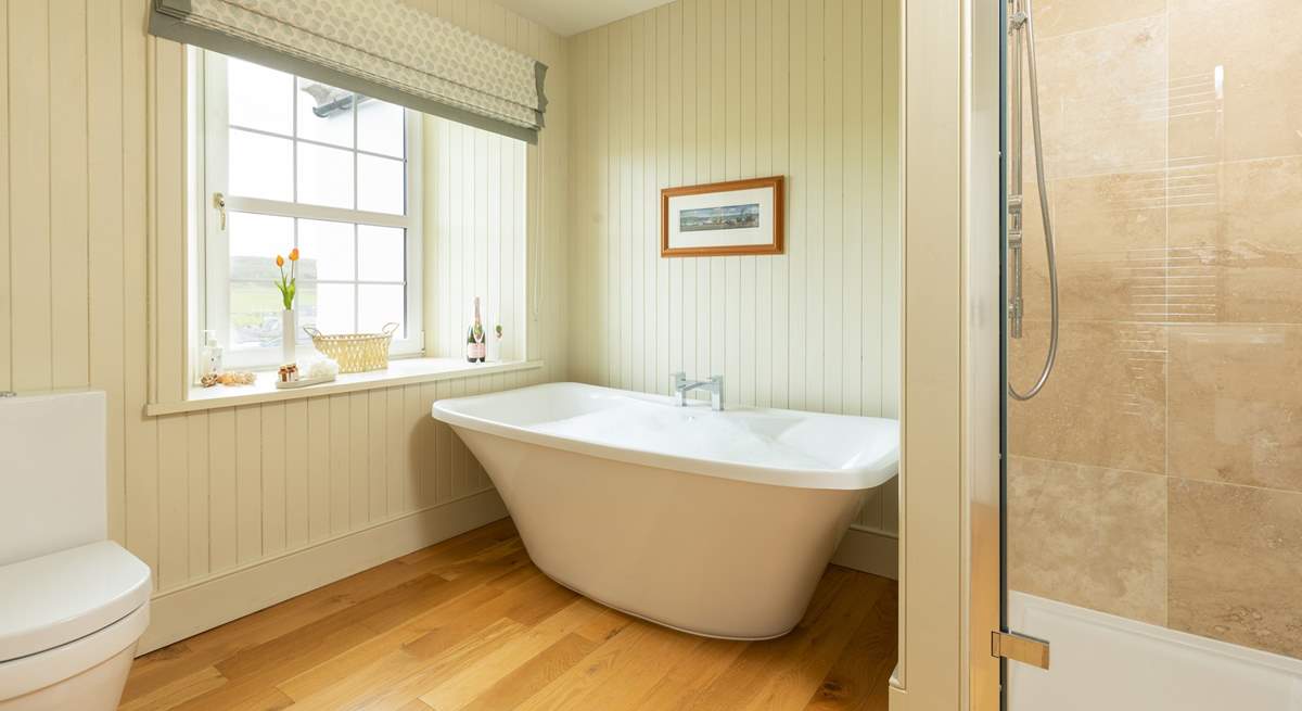 Soak in a bath of bubbles and enjoy a moment of relaxation in the en suite to bedroom 5.