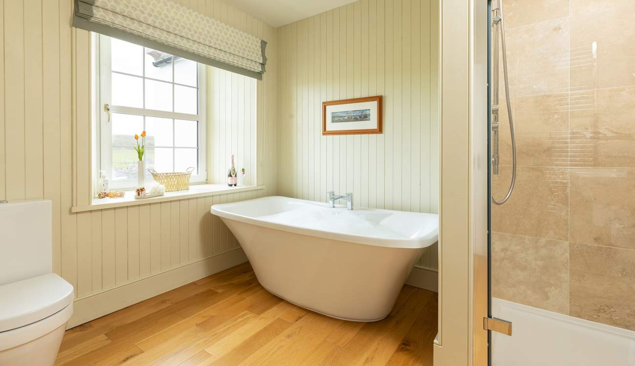 Soak in a bath of bubbles and enjoy a moment of relaxation in the en suite to bedroom 5.
