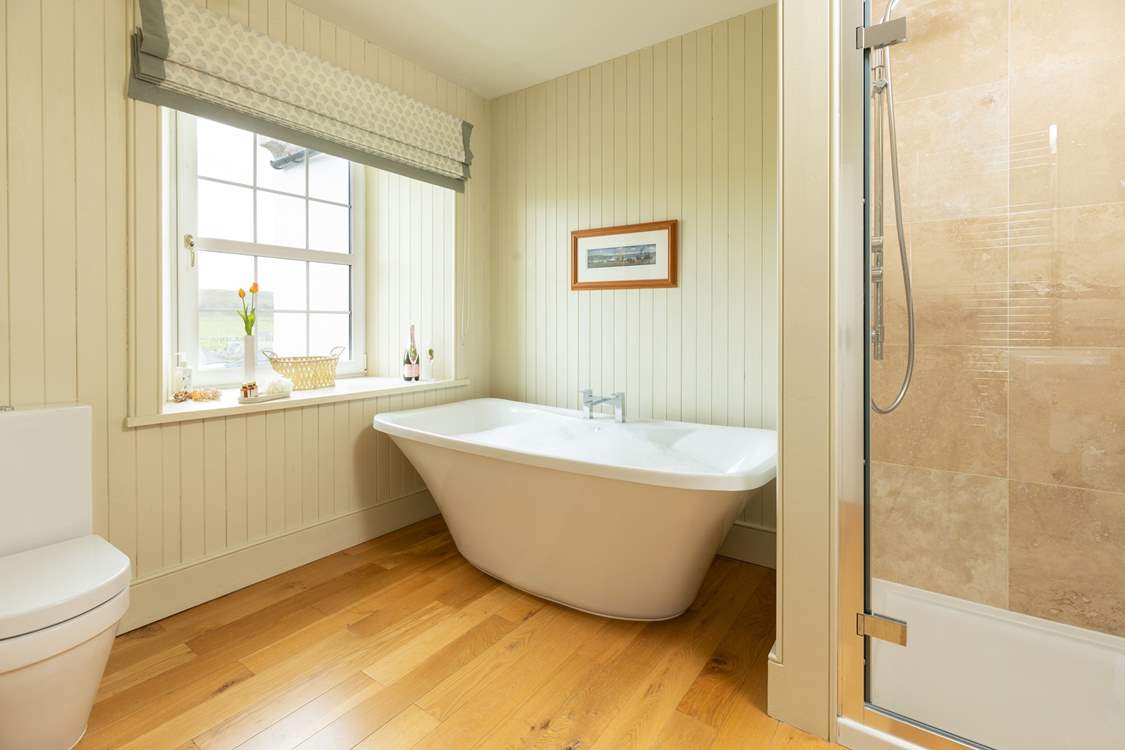 Soak in a bath of bubbles and enjoy a moment of relaxation in the en suite to bedroom 5.