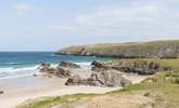 Sango Bay with the turquoise sea crashing over the rocks. - Thumbnail Image