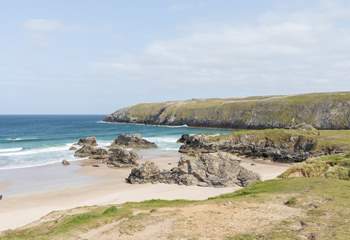 Sango Bay with the turquoise sea crashing over the rocks.