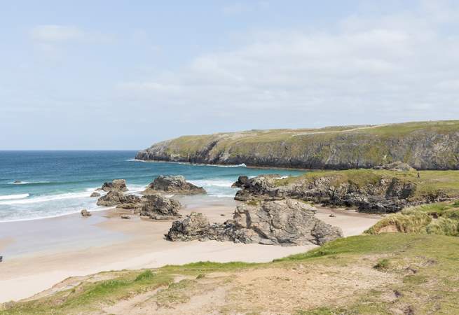 Sango Bay with the turquoise sea crashing over the rocks.