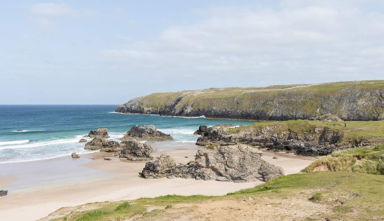 Sango Bay with the turquoise sea crashing over the rocks.
