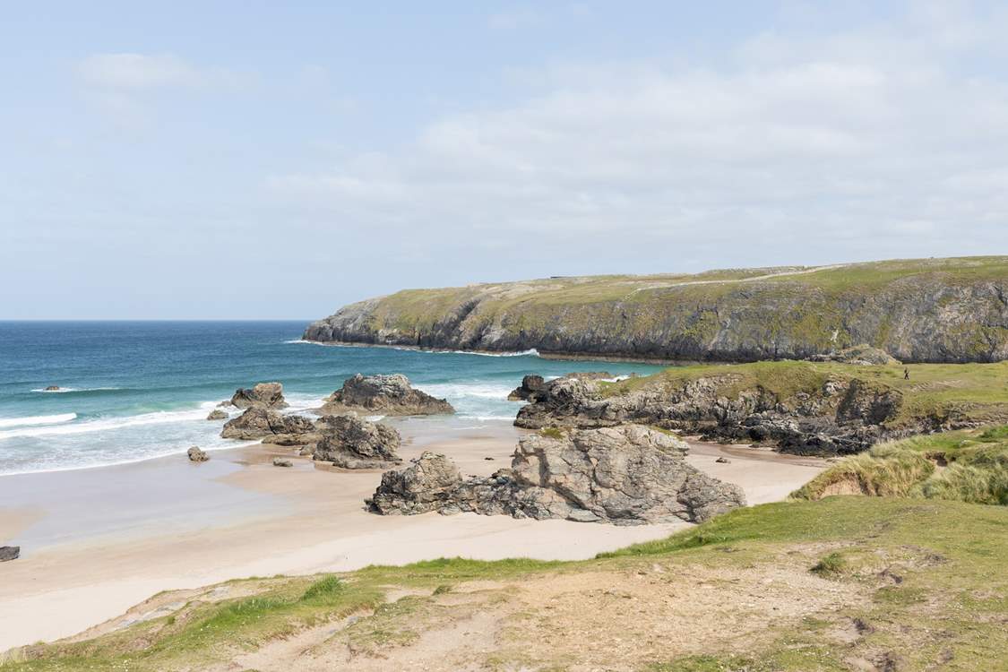 Sango Bay with the turquoise sea crashing over the rocks.