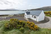 Welcome to Shore Cottage., a traditional highland cottage set in spectacular surroundings.