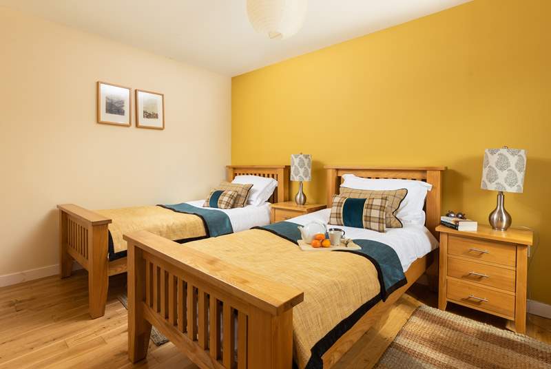 The twin bedroom has storage and there are views over the fields.