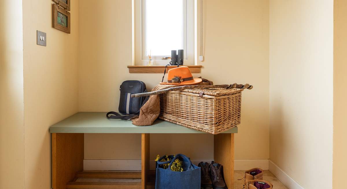 There's a handy bench for sitting and removing your muddy boots after a day out walking.