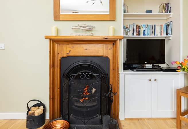 Relax in front of the fire and watch a movie on the Smart TV.