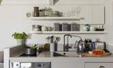 The stylish kitchen is well equipped with everything you'll need during your stay. - Thumbnail Image