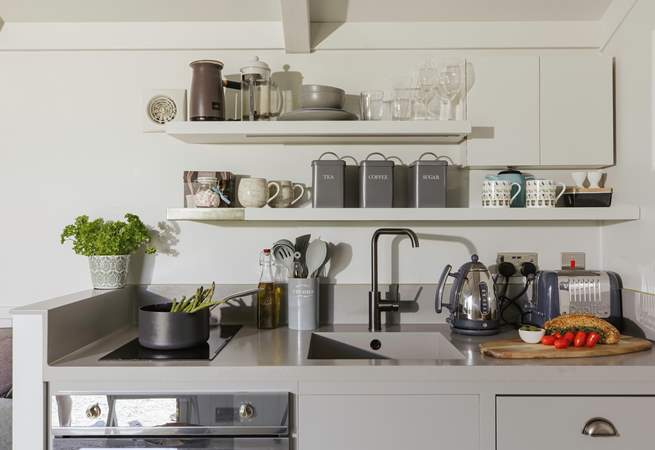 The stylish kitchen is well equipped with everything you'll need during your stay.