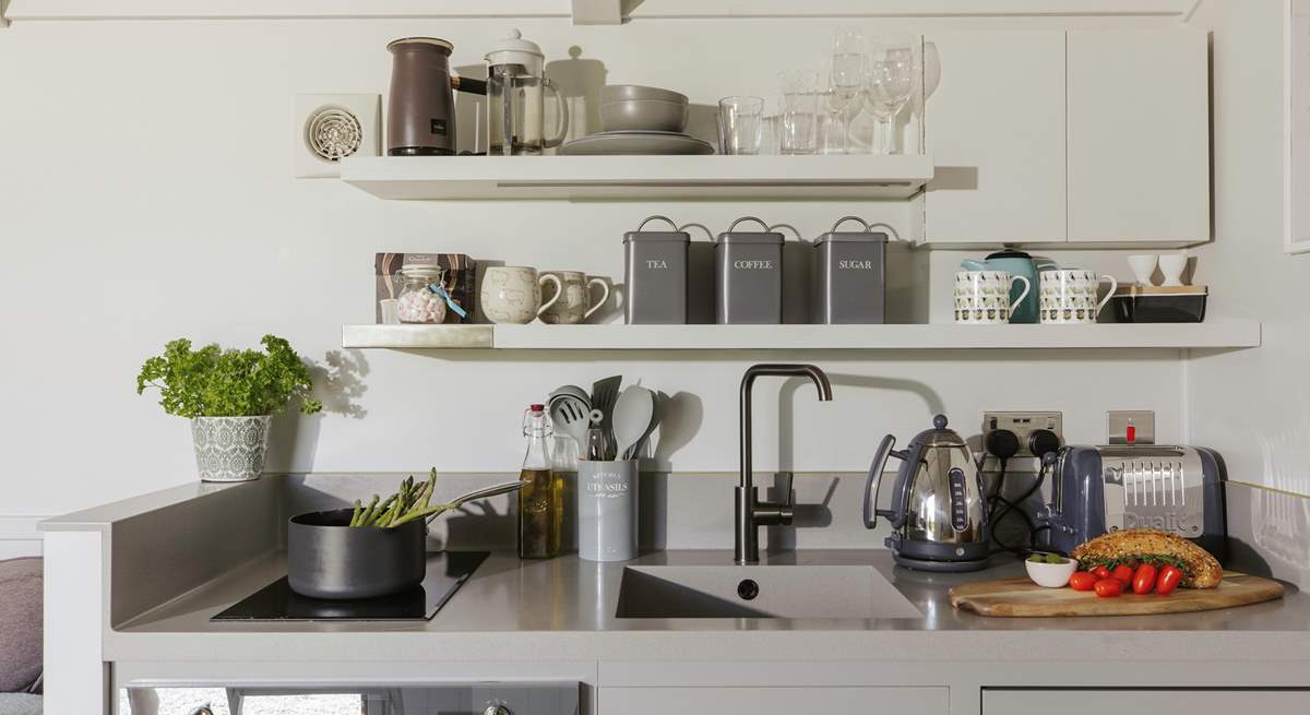 The stylish kitchen is well equipped with everything you'll need during your stay.