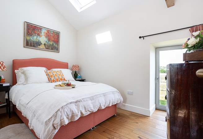 Bedroom 1 has a door out into the garden, perfect for a morning stroll.