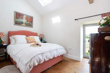 Bedroom 1 has a door out into the garden, perfect for a morning stroll.