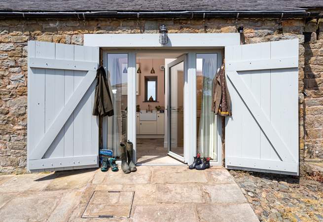 The entrance door with original barn door shutters, get your boots ready for a day of hiking.