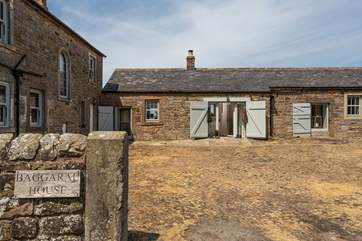 Traditional cobbled yard, showing the farmhouse which will always be unoccupied during your stay.