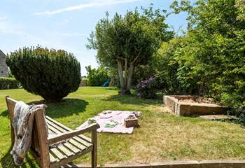 The large garden has a children's play frame and a large sandpit for hours of fun. 