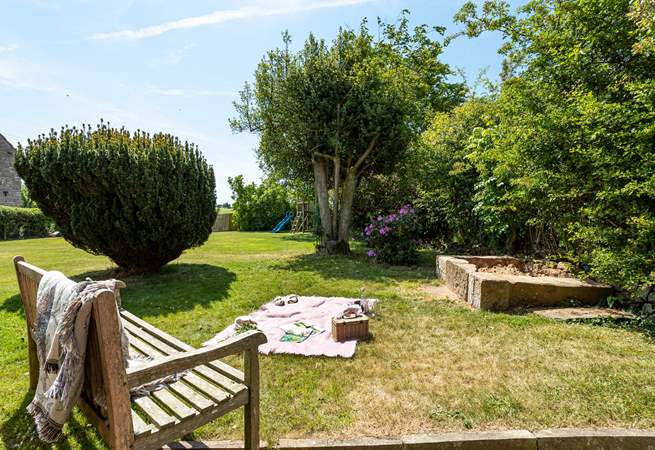 The large garden has a children's play frame and a large sandpit for hours of fun. 