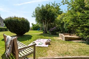 The large garden has a children's play frame and a large sandpit for hours of fun.