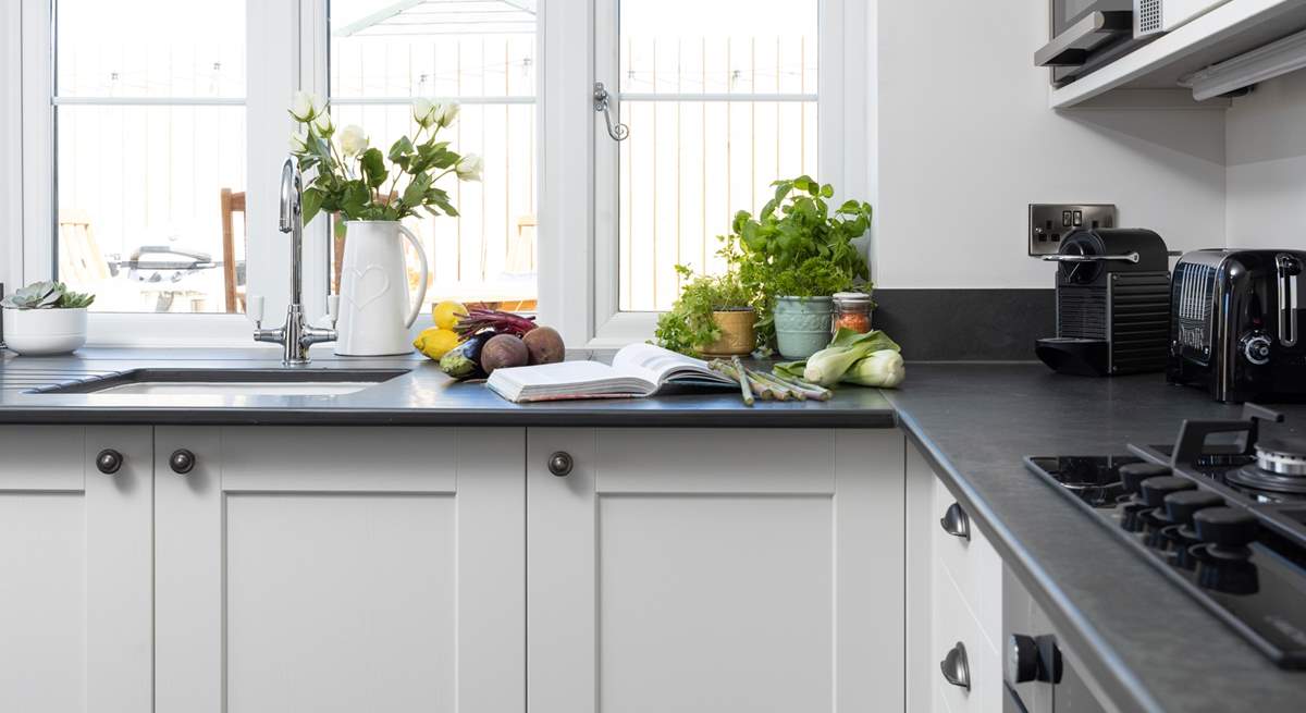 The kitchen looks out over your decking area.