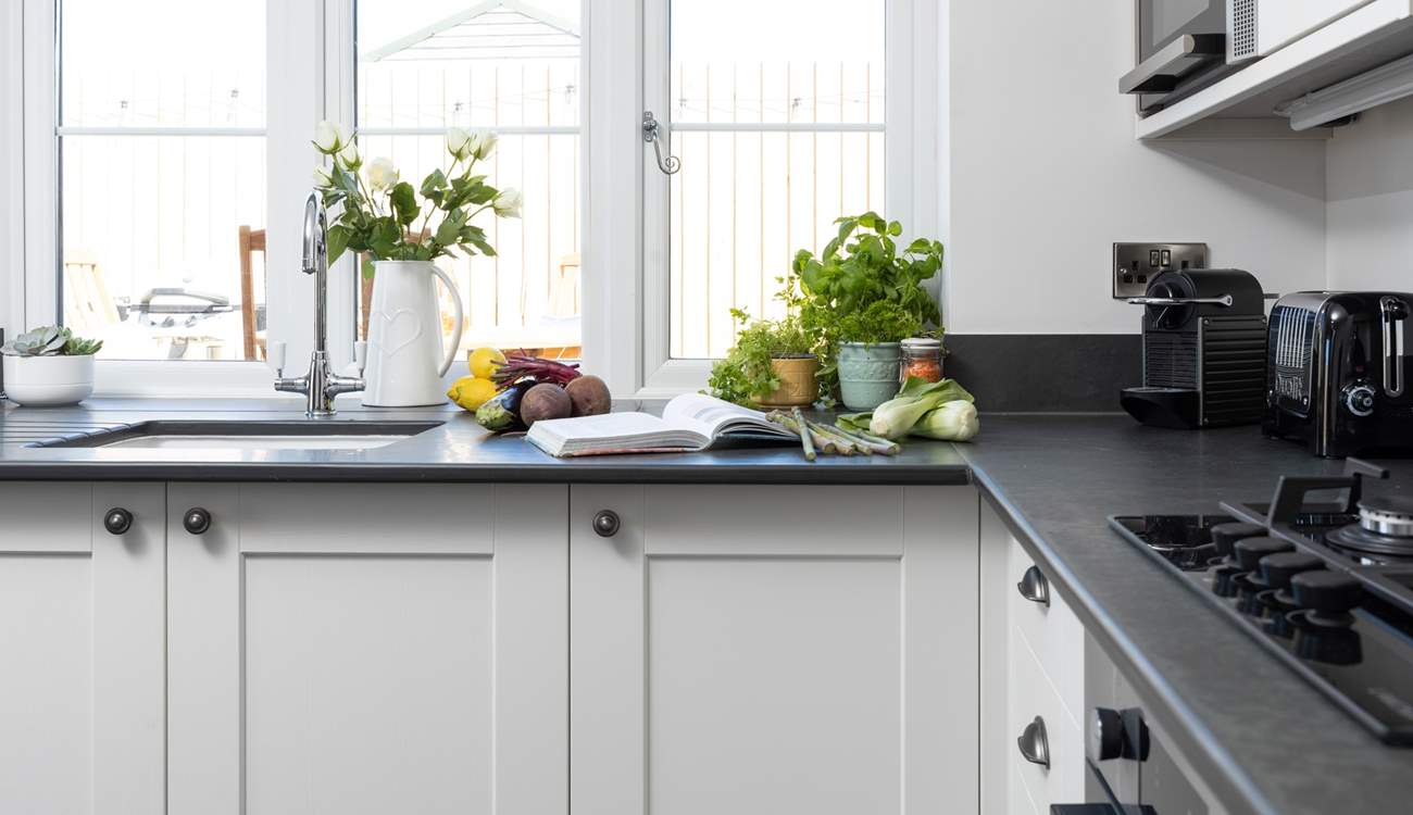 The kitchen looks out over your decking area.