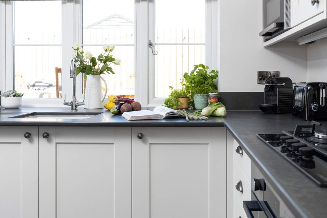The kitchen looks out over your decking area.