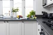The kitchen looks out over your decking area.