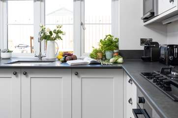 The kitchen looks out over your decking area.