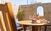 The decking area also has the perfect al fresco eating spot.  - Thumbnail Image