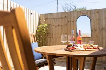 The decking area also has the perfect al fresco eating spot.