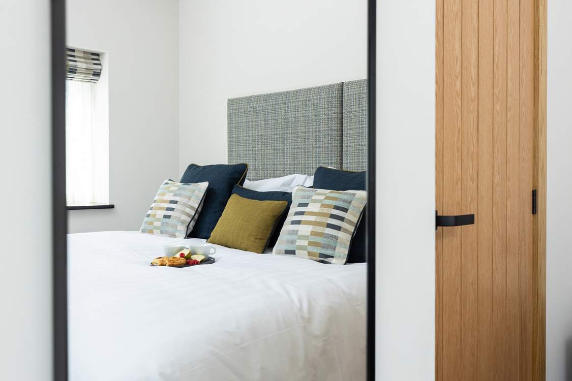 Bedroom 1 has a lovely relaxed feel thanks to the styling and fabrics.
