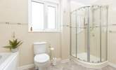 The spacious family bathroom is situated between bedroom 1 and 2. It features a bath with separate shower cubicle, WC, and wash-basin. - Thumbnail Image