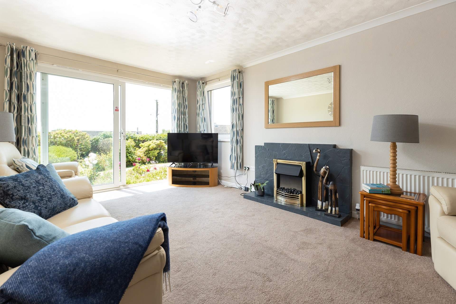 The living-room has sliding doors to let the clean Cornish air in. Please note, this door is not for access.