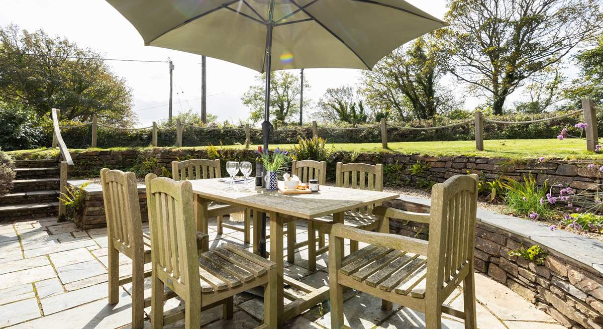 The patio has been cleverly designed at a lower elevation, tucked behind the gable end.