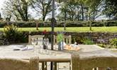 Kick back with some treats at the grand al fresco table whilst the children enjoy the garden. - Thumbnail Image