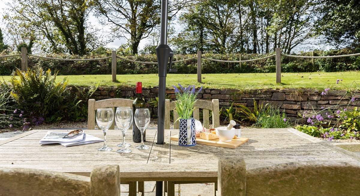 Kick back with some treats at the grand al fresco table whilst the children enjoy the garden.