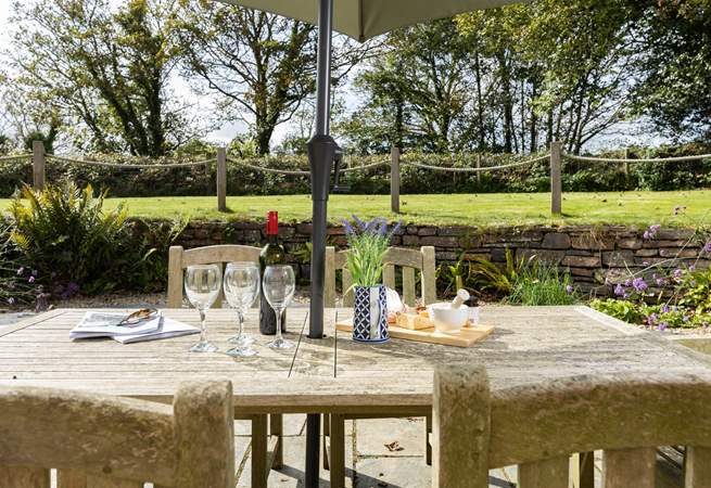 Kick back with some treats at the grand al fresco table whilst the children enjoy the garden.