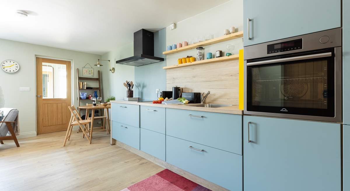 The stylish kitchen/dining area has all you need to cook a holiday meal. 