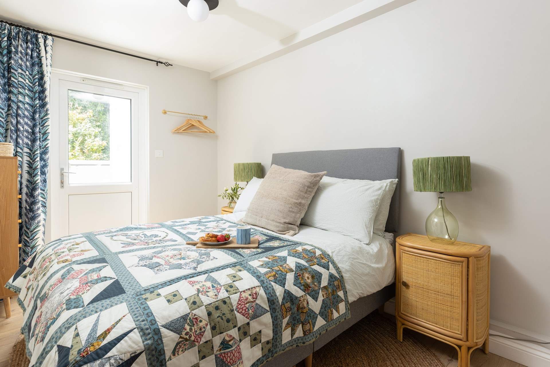 Bedroom 1 has a double bed and access to the rear courtyard. 