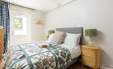 Bedroom 1 has a double bed and access to the rear courtyard.  - Thumbnail Image