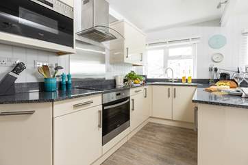 The living space has a well-equipped kitchen area.