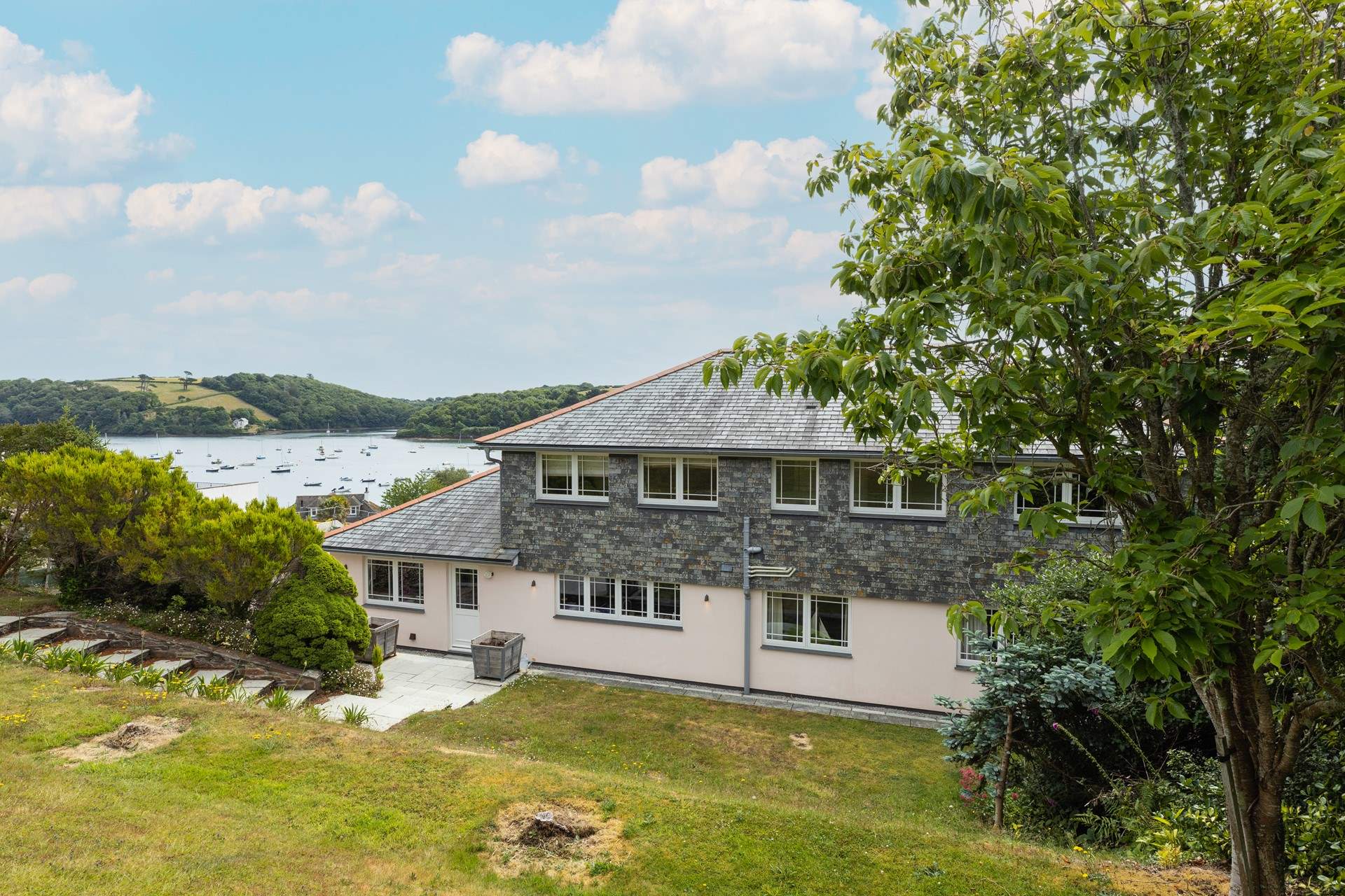 The view from the raised rear garden across to the bobbing boats beyond.
